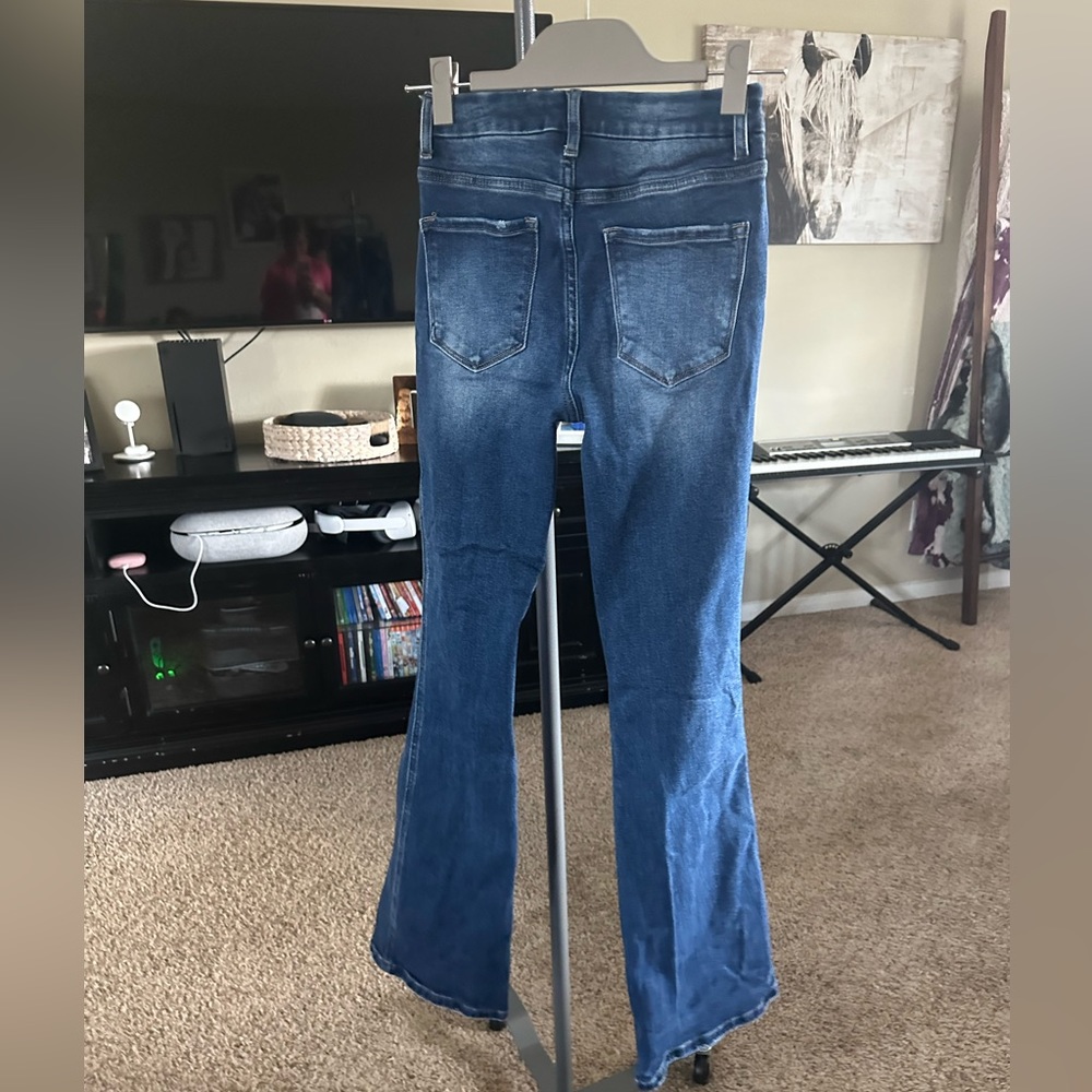 Boot cut, small ripped jeans